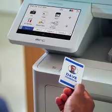 User authenticating at a Brother multifunction system with an identification card